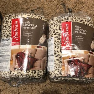 Two heated fleece blankets